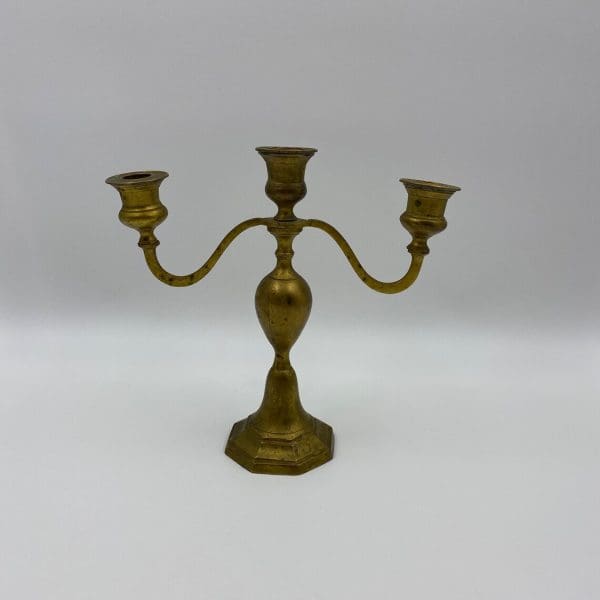 vintage brass candelabra hold three candles