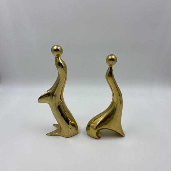 vintage brass figurines sides of sea lions