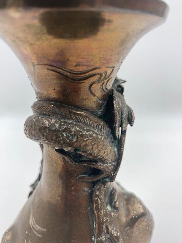 antique Japanese bronze vase close to show detailed work