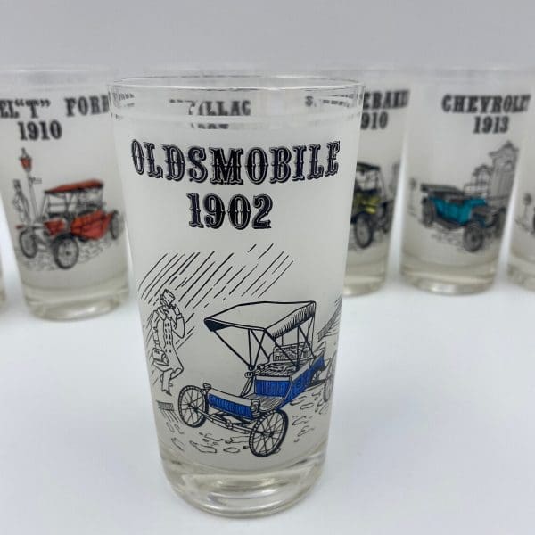 antique car drinking glasses front Oldsmobile 1902