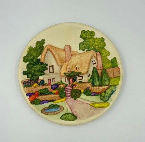 vintage hand painted plates front cottage