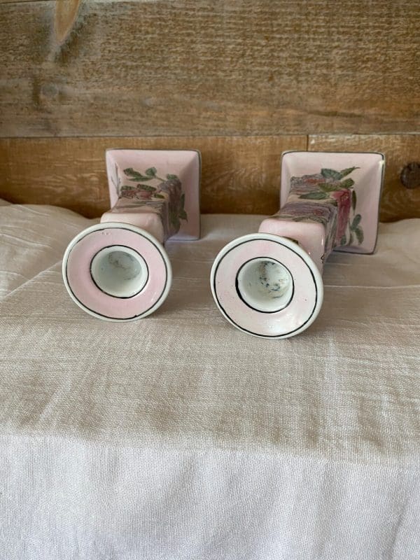 pink ceramic candle holder laying on side showing inside of tops