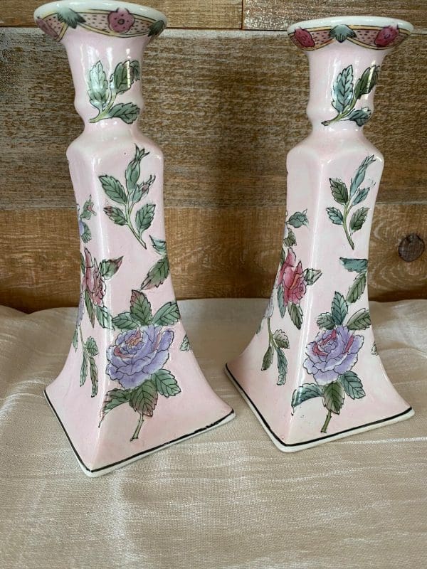 pink ceramic candle holder close of back showing the flowers design and pink color is all around