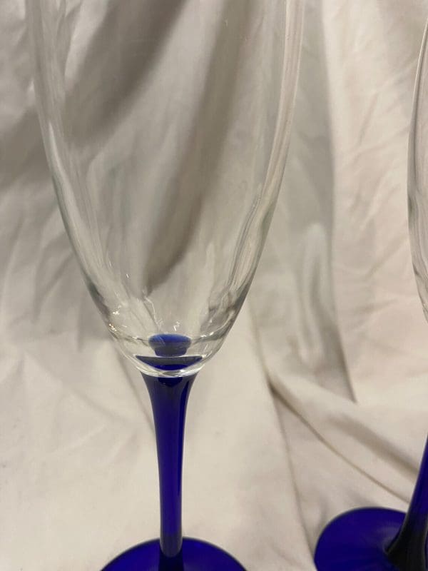 vintage champagne flutes close blue stems clear bell