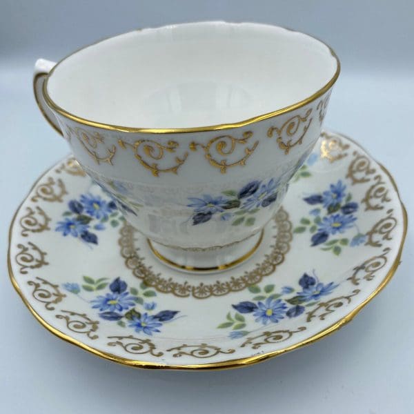 vintage Cloclough bone china close of tea cup displayed on saucer handle on left