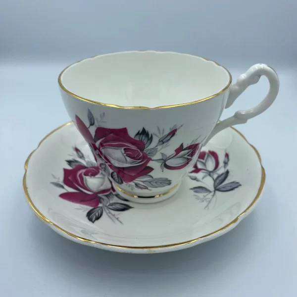 pink rose tea cup Consort handle on right gold trim on white bone china