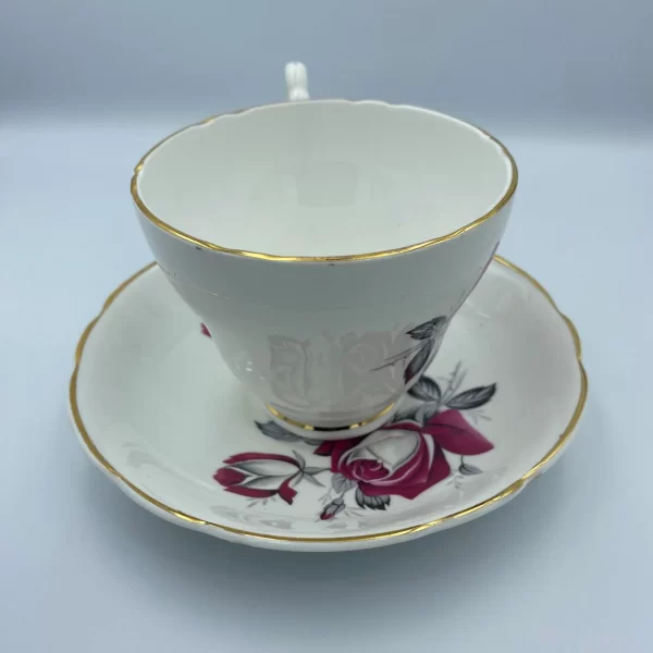 pink rose tea cup Consort handle in back