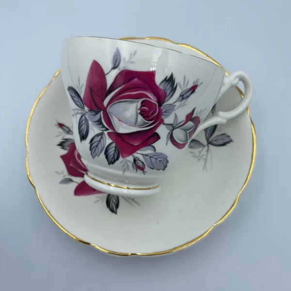 pink rose tea cup Consort tea cup laying on top of saucer showing the design