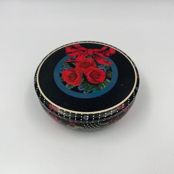 vintage cookie tins black with red roses and red ribbon