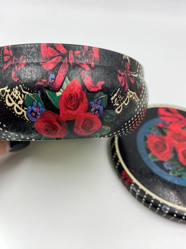 vintage cookie tins side close showing red roses on black