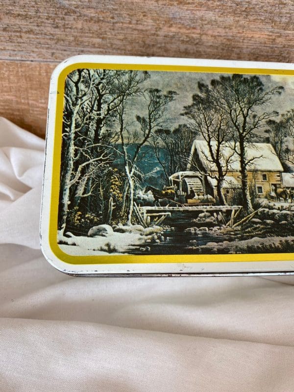 Currier and Ives tins edge with paint missing