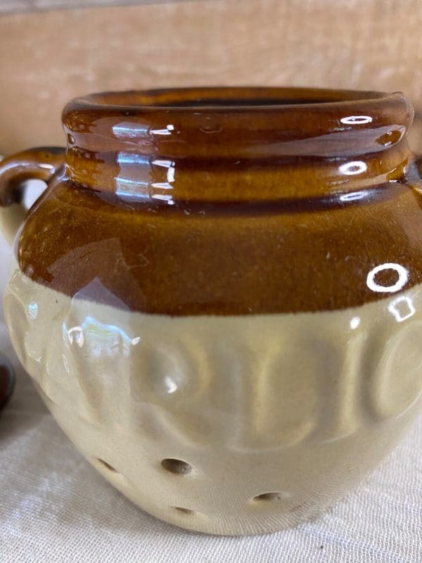 ceramic garlic pot close to show design and tan brown color