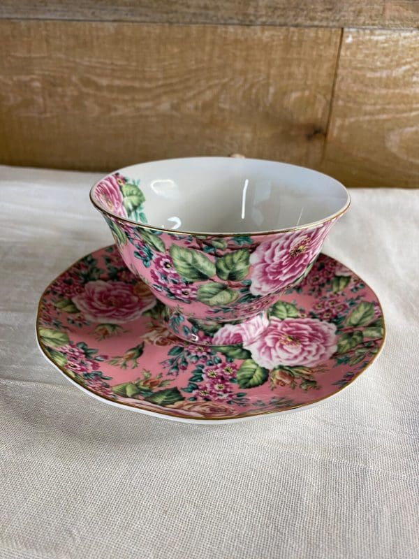 chintz tea cups facing