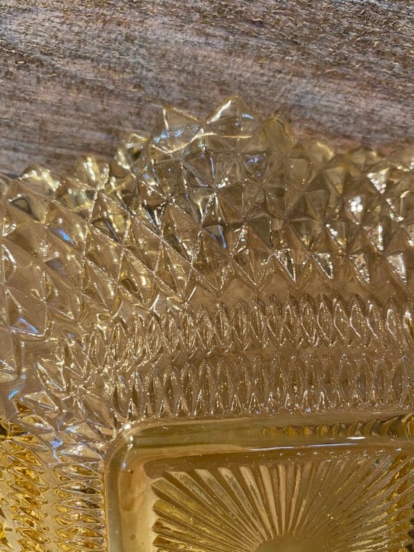 amber hobnail glass edge of bowl