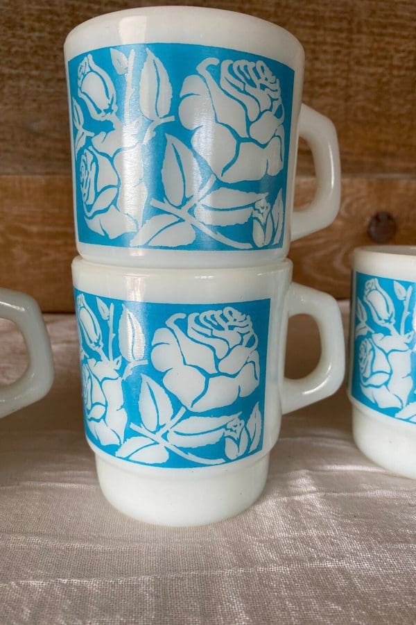 Fire King milk glass mug blue with white flowers stacked