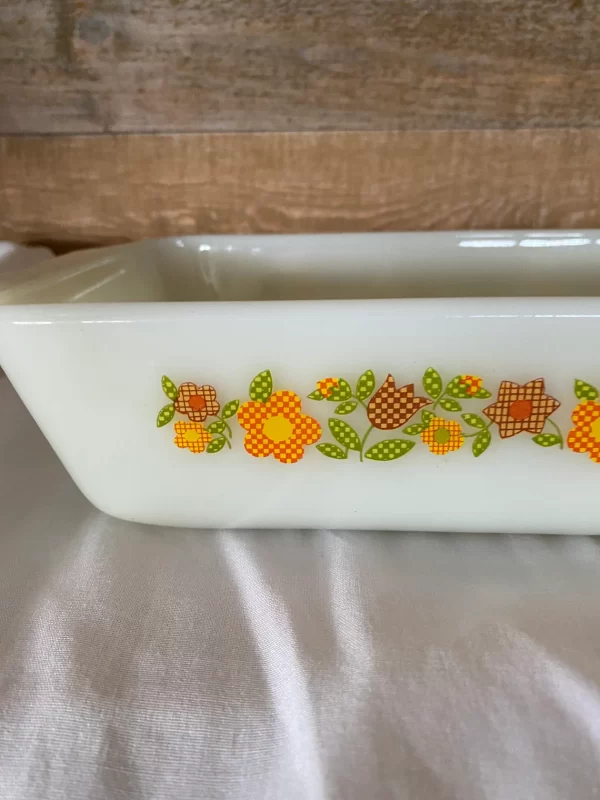 Fire king loaf pan Gingham Flowers Plaid orange yellow red green on milk glass close