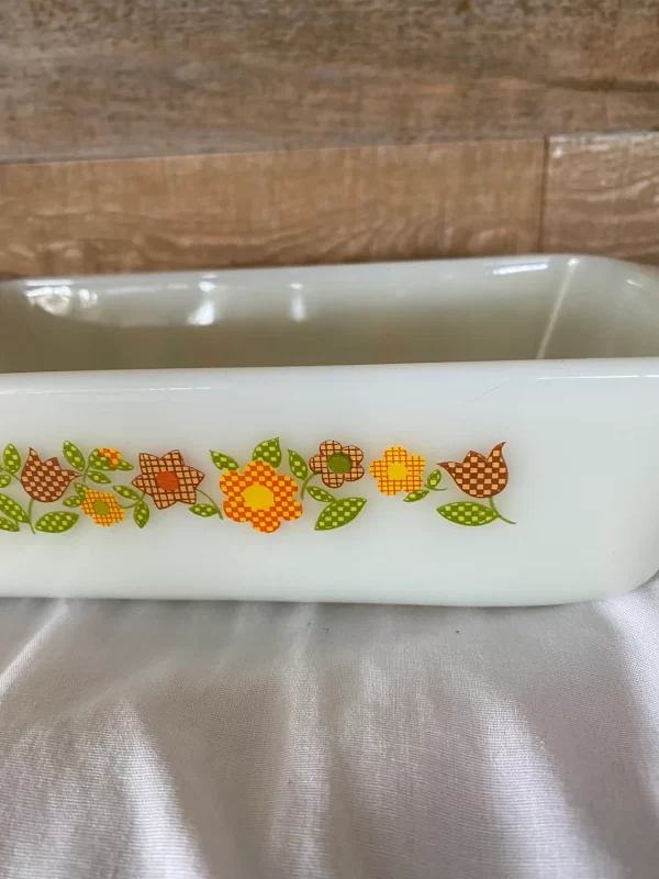 Fire king loaf pan Gingham Flowers Plaid orange yellow red green on milk glass close to show design