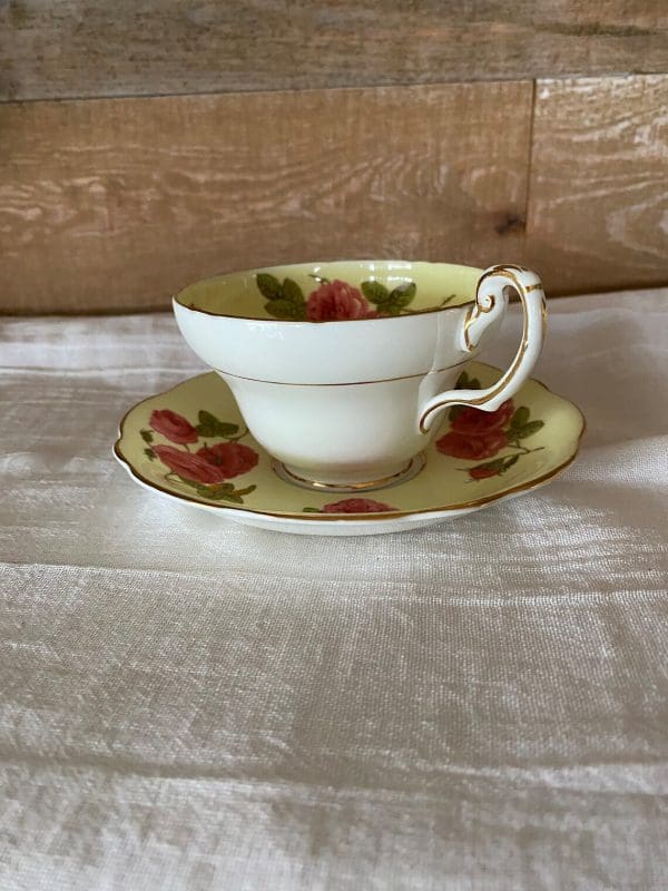 Foley tea cup and saucer set yellow with large cabbage roses side