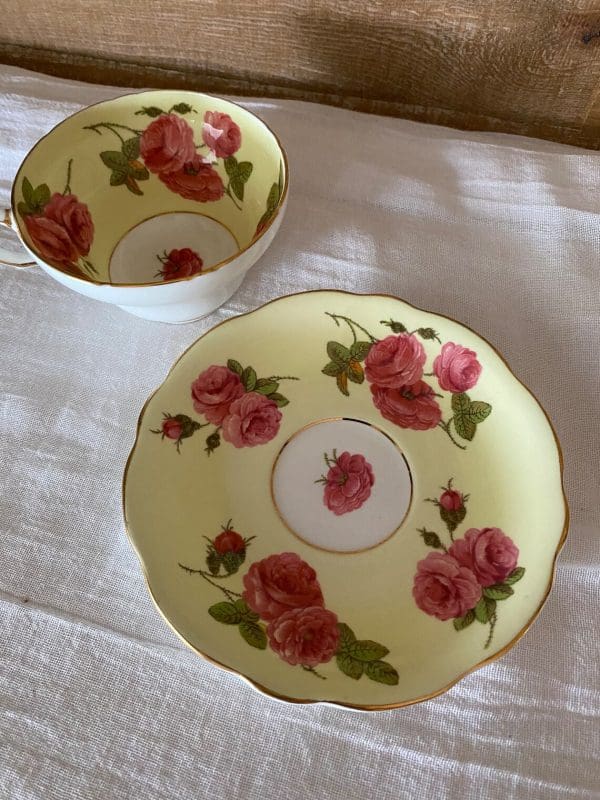 Foley tea cup and saucer set yellow with large cabbage roses top view of set