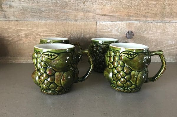 green coffee mugs fruit embossed