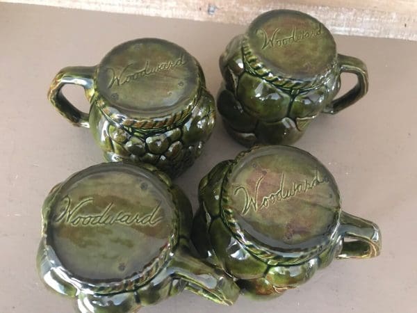 green coffee mugs bottoms signed