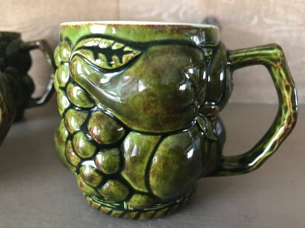 green coffee mugs close of one