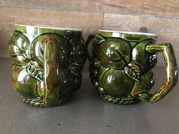 green coffee mugs handles