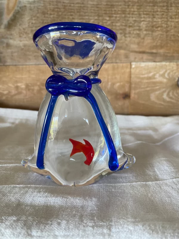 glass fish decor close showing goldfish in bag with blue bow