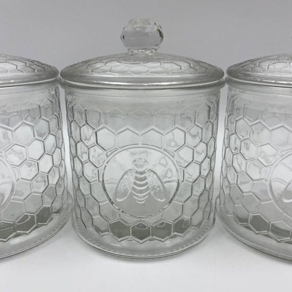 honeycomb canister with honey bee on front clear embossed glass two of three