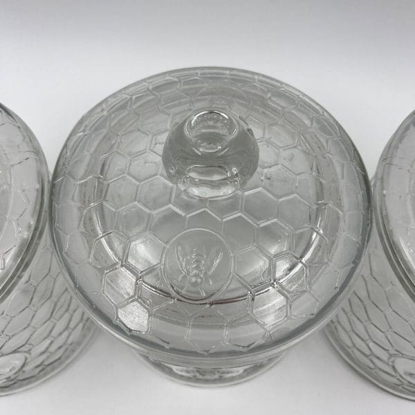 honeycomb canister with honey bee on front clear embossed glass close top