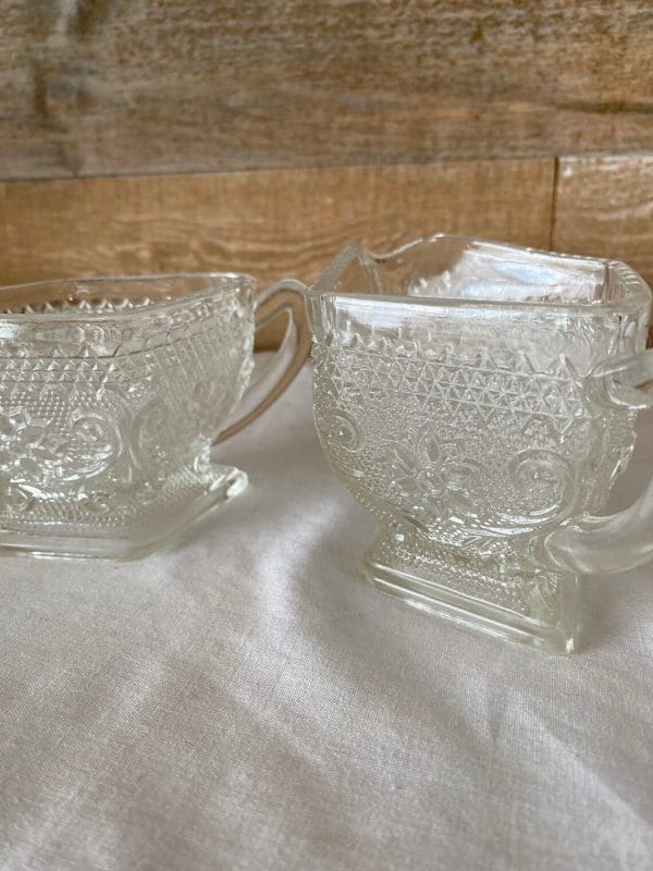 vintage glass sugar and creamer sets close to show detail