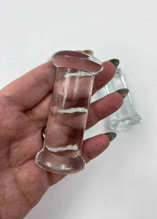 glass knife rests in hand to show size