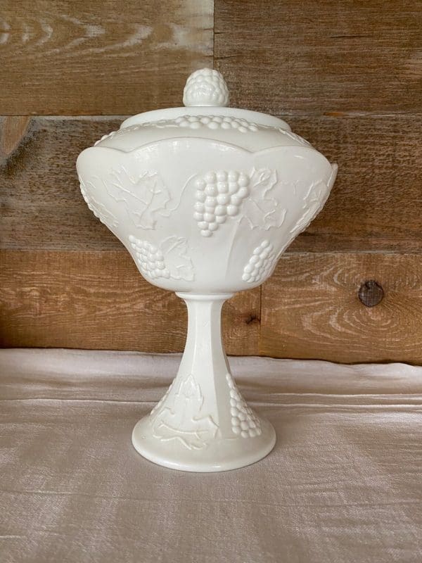 milk glass candy dish with grapes upward view