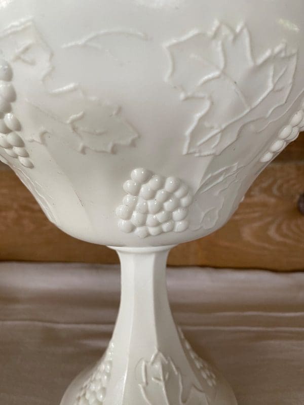 milk glass candy dish with grapes close up grapes