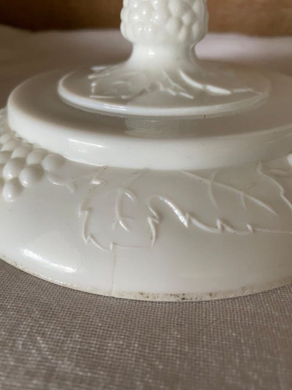 milk glass candy dish with grapes close showing mold mark