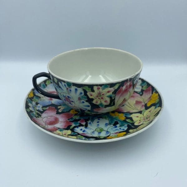 black tea cups handle on left multi color flowers hand painted