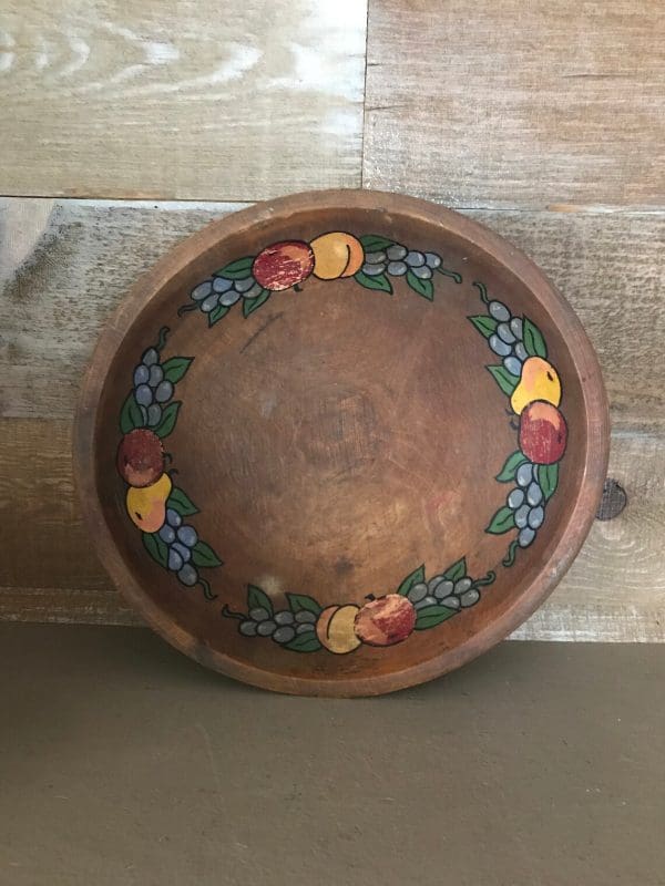 Munising wooden bowl on side showing inside fruit hand painted design