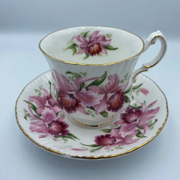 Paragon tea cup and saucer pink flowers handle on right side showing front of teacup on top of saucer