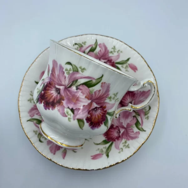 Paragon tea cup and saucer teacup on side on top of saucer showing front pink flowers