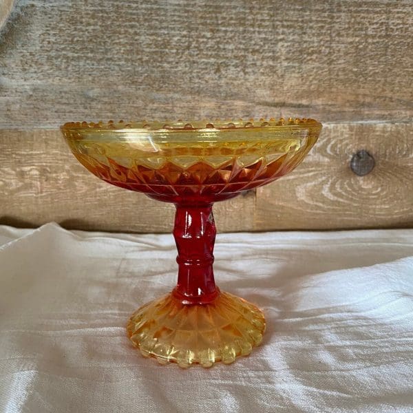 red and yellow glass candy dish