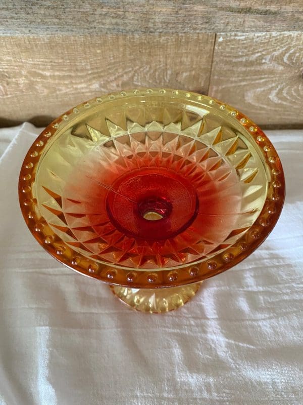 red and yellow glass candy dish close top