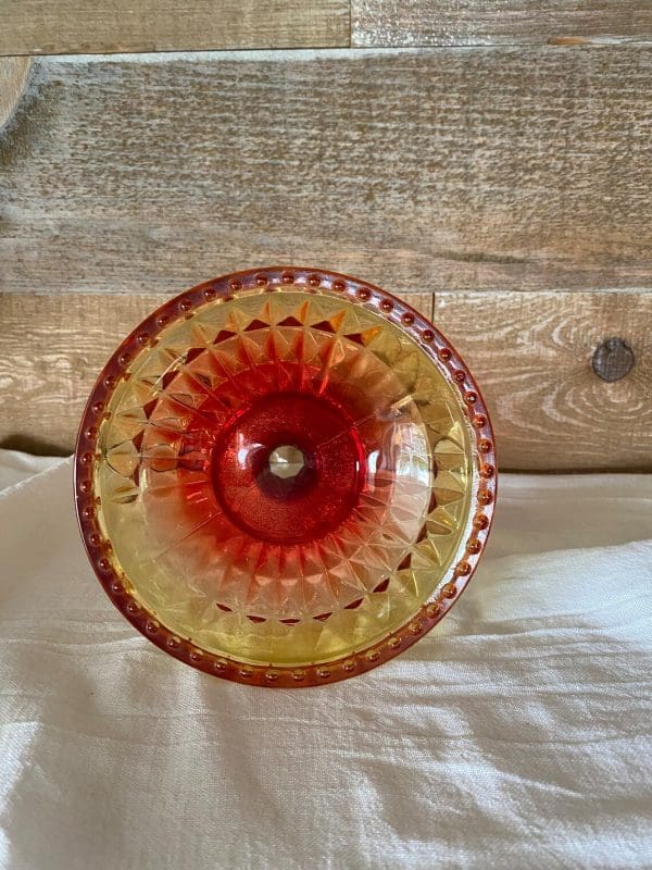 red and yellow glass candy dish inside