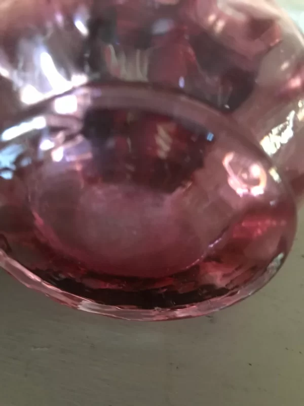 pink glass creamer bottom