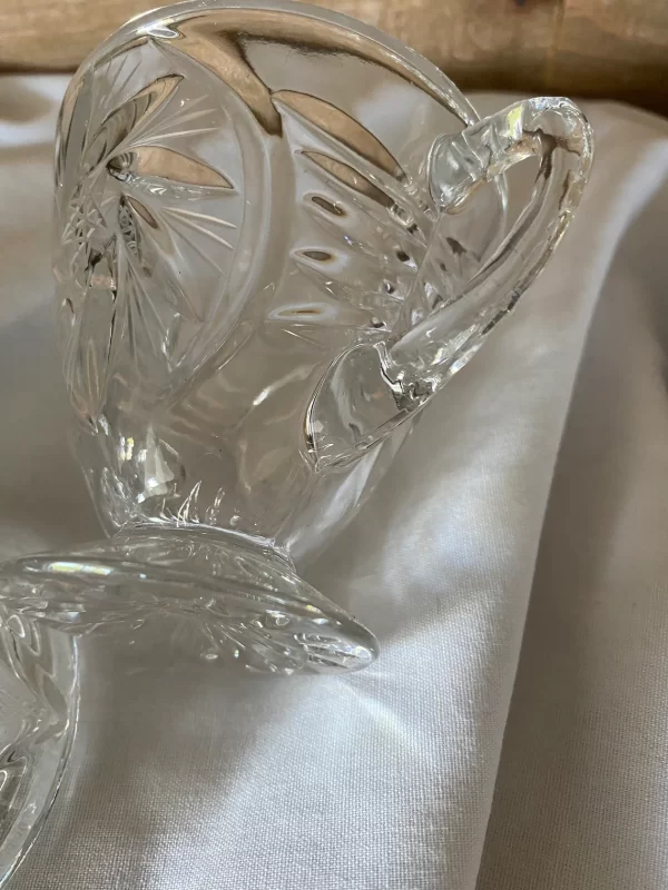 crystal sugar bowl with lid close to handle