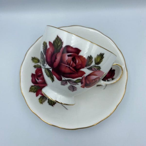 Queen Anne China Dark Pink Rose Teacup and Saucer Set on side showing off rose