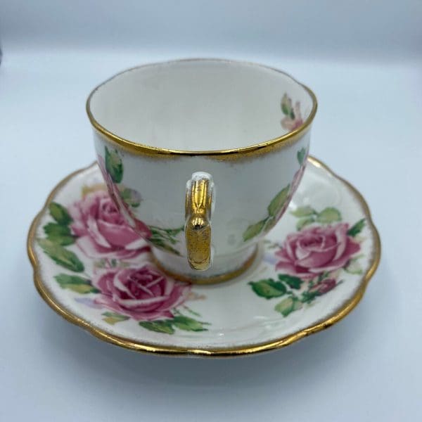 Queen Anne tea cup and saucer gold trim handle