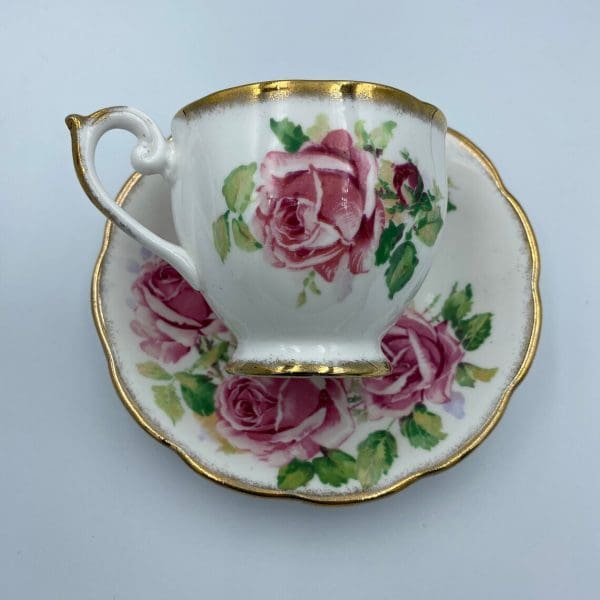 Queen Anne tea cup and saucer tea cup on side on top of saucer