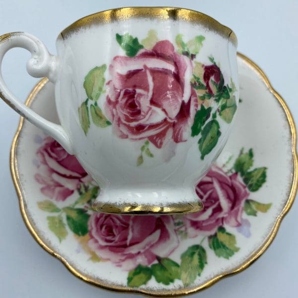 Queen Anne tea cup and saucer close showing pink roses detail