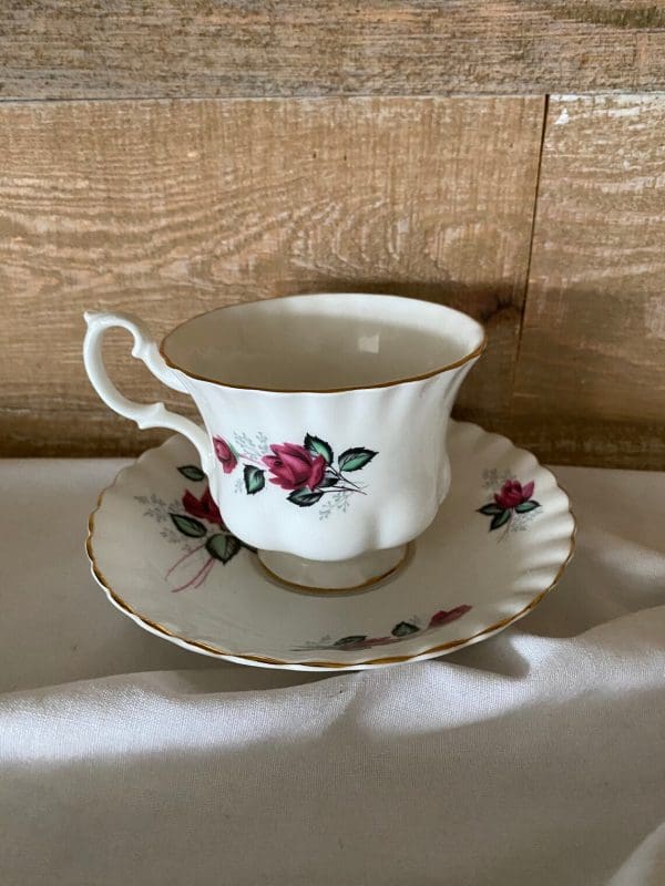 Royal Albert Montrose shape tea cup and saucer deep pink roses left side