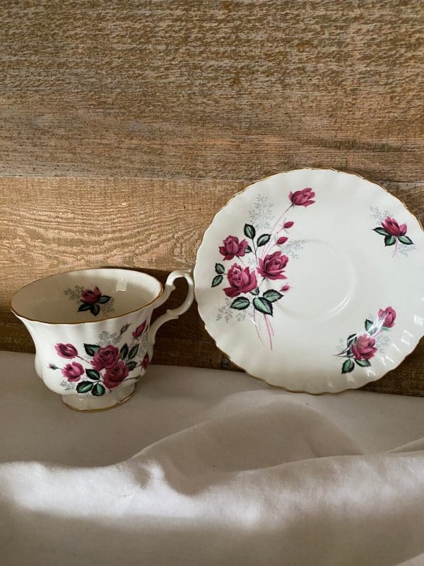 Royal Albert Montrose shape tea cup and saucer deep pink roses on both pieces